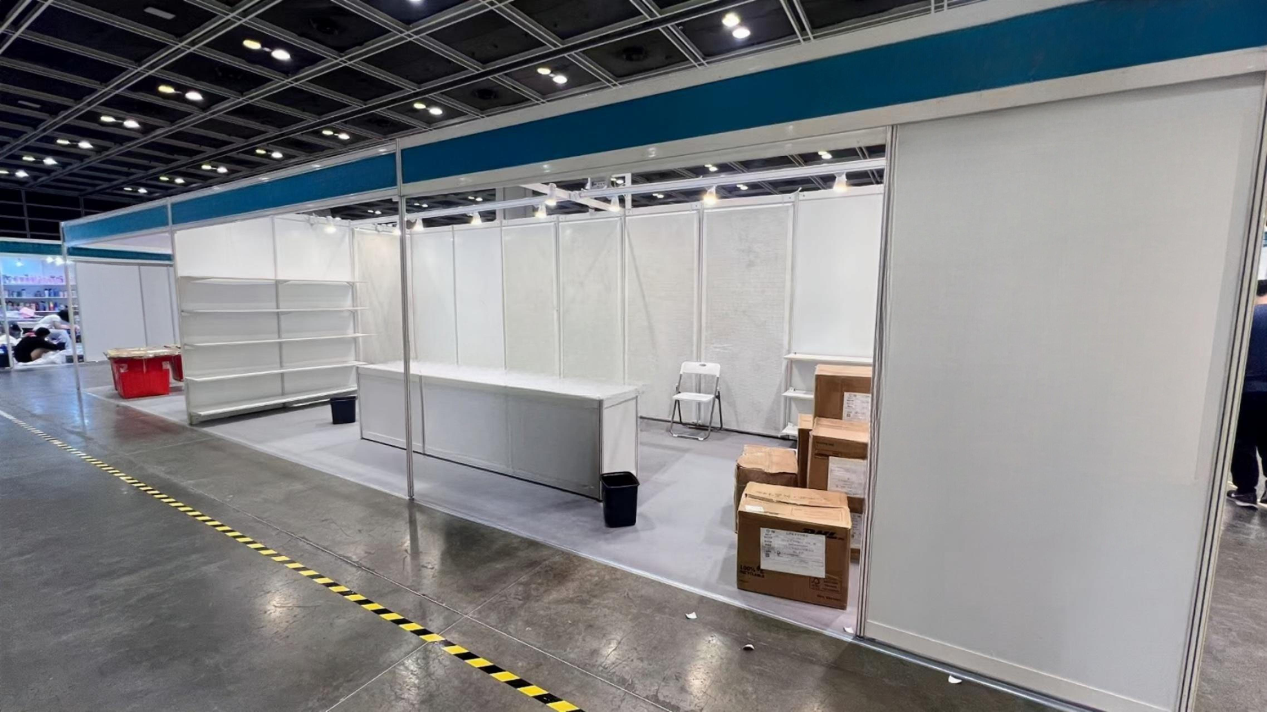 LINZHEN empty booth shell with packing boxes before build-up
